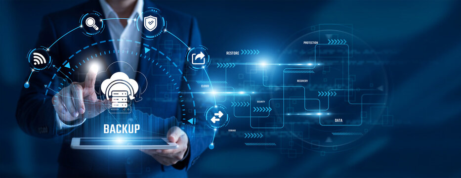 IT Administrator using tablet analysing Backup data. Data protection, disaster recovery, cloud storage, secure infrastructure, business continuity, information security.