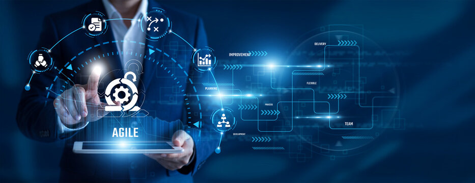 Agile Project Manager using tablet analysing Agile data. Sprint planning, team collaboration, iterative development, project delivery, continuous improvement, software innovation.