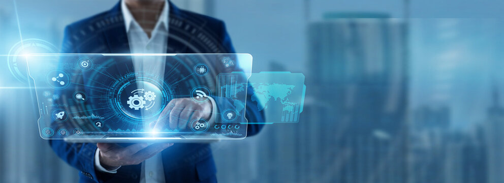 Businessman Using Tablet for Automation and analyzing operational workflow data. Streamlining business processes, increasing productivity, reducing manual tasks and improving efficiency.