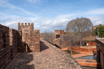 View of the castle walls in the ancient town of Silves in the Algarve, Portugal © smartin69