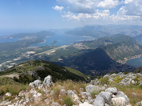 Panoramic summer view of the blue sea and majestic mountains under a clear sky, scenic Mediterranean coastal landscape