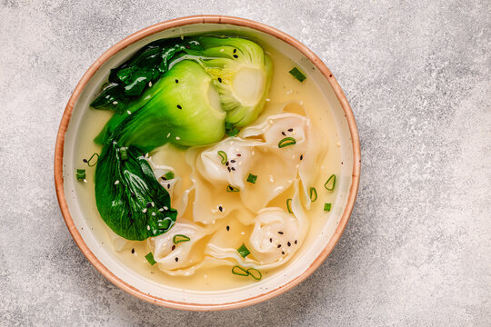 Soup with wontons and bok choy