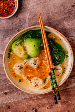 Soup with wontons and bok choy