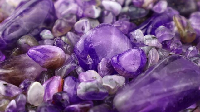 Purple and violet amethyst stone crystals and gems circle rotation close up