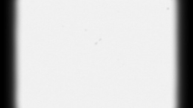 Black vintage rounded square frame animation with zoom motion from white background to black rounded square frame with CRT scanlines and film texture. 4K animated for retro frame and video editing.
