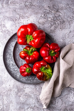 Fresh ripe sweet bell pepper on grey background