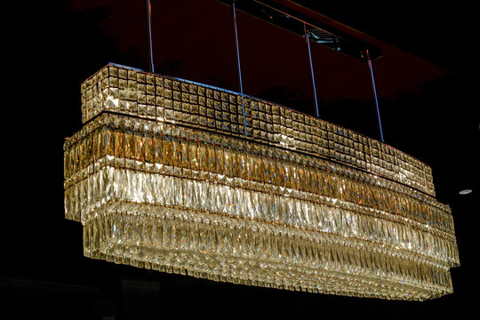 Luxury Crystals chanderliers hung under the white celing,royal lamp in the living room,Antique Ceiling light,mock up interior in classic style,space for text.