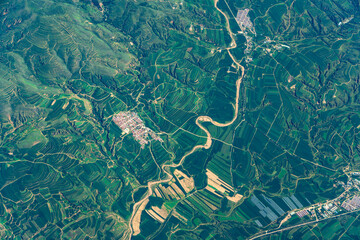 Obraz premium aerial view of green agriculture field in mountain area