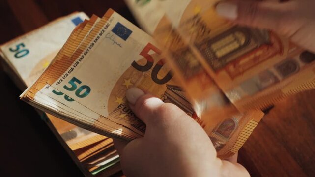 A man counts euros. The concept of salary and savings. High quality 4k footage