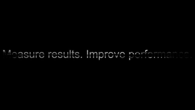 Text displaying the business slogan measure results improve performance appears in a sleek metallic font against a pitch black background.