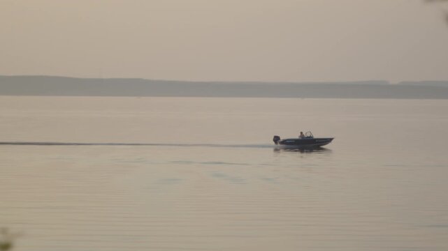 Motor boat moves fast on the lake