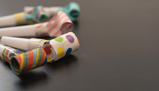 Party Horn Noisemakers Scattered on Table After Use