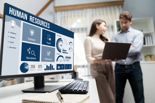 Human resources management software on computer screen helping human resources employee to manage recruitment, payroll, staff searching and KPI evaluation brisk