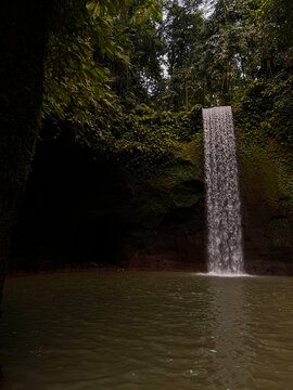Aerial View of Tibumana Waterfall Surrounded by Tropical Rainforest in Bali, Indonesia