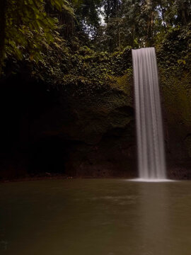 Aerial View of Tibumana Waterfall Surrounded by Tropical Rainforest in Bali, Indonesia