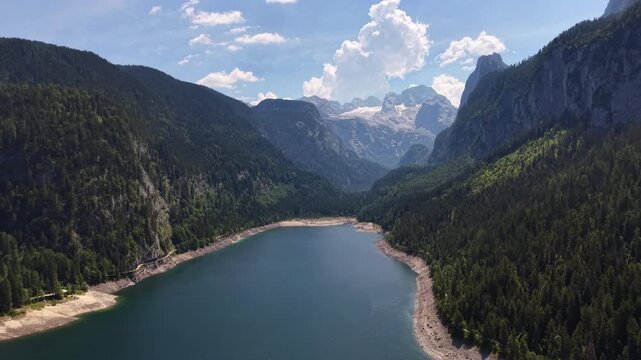Aerial View Gosau Alpine Lake Beneath Dachstein Mountains

Drone footage reveals tranquil mountain waters framed by forests and dramatic peaks, Gosau, Austria, 11 August 2026.

