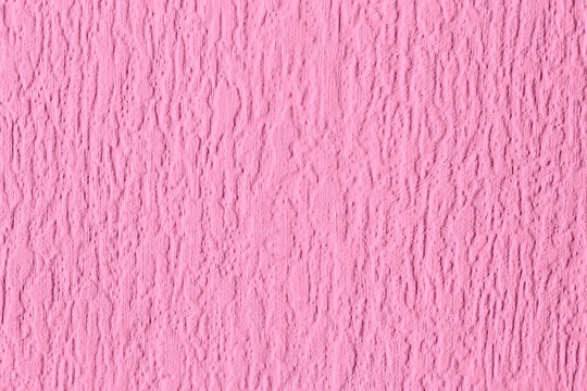 Close-up of pink painted embossed anaglypta wallpaper wallcovering background. Retro interior design wallpaper.