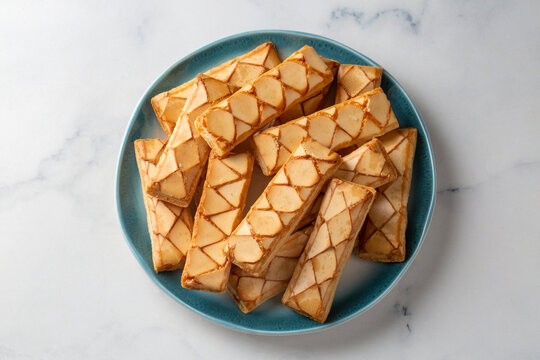 Traditional Italian Sfogliatine Glassate Glazed Puff Pastry Biscuits on Plate