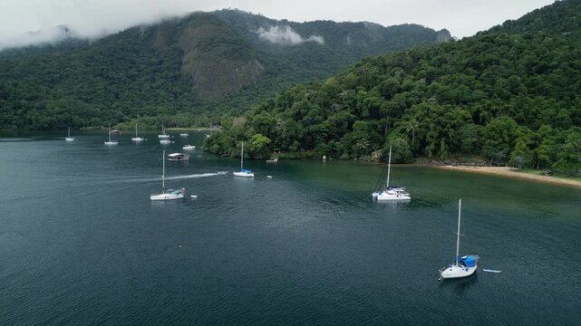 Boats anchored in a calm bay. Ilha Grande, Brazil