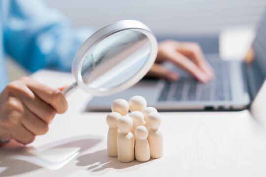 Customer analysis concept. Magnifying glass examining people for target audience research and selection; customer, demographic, research, HR, recruitment