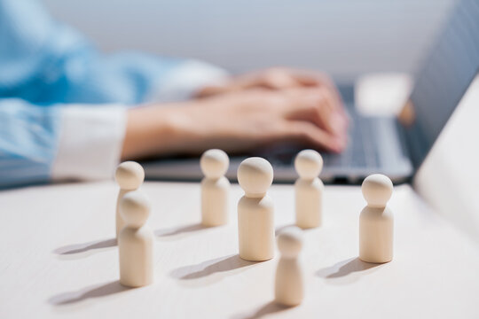 Human resources concept. Wooden people represent workforce organization and team management; recruitment, leadership, talent, planning, collaboration