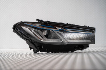 Modern LED car headlight isolated on white background © nayefhammouri