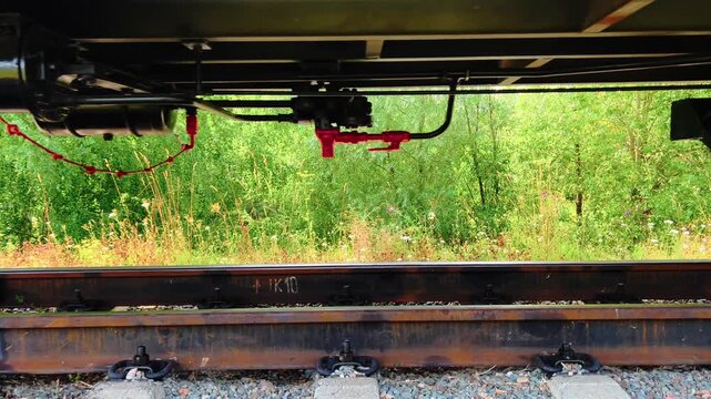 Close railway wheel assembly moves along a narrow gauge track