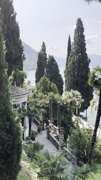 View of Lake Como and mountains from a historic villa in Varenna, Italy