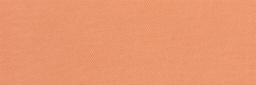 Terracotta orange fabric texture close-up, soft peach cotton textile background, warm salmon colored woven material surface, minimalist cloth backdrop for fashion.