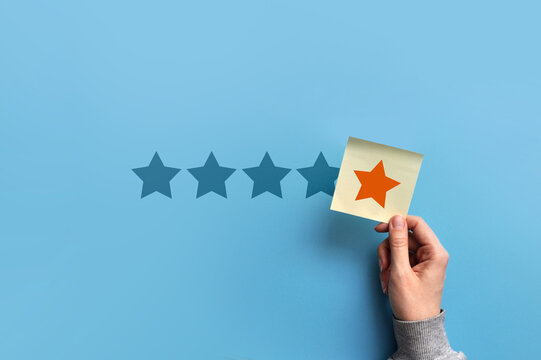 Five Star Rating Concept with Hand Placing a Positive Review