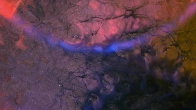 Mixing colored alcohol inks to create patterns on a surface