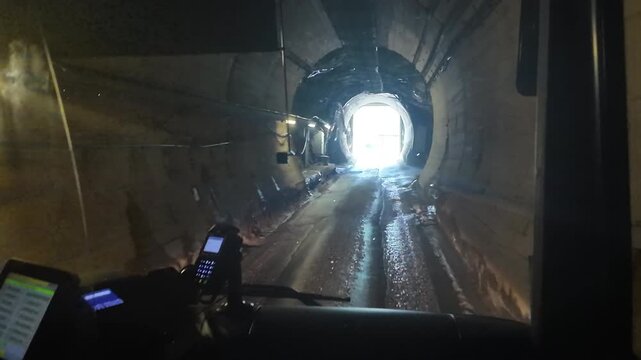 Driving Through Mountain Tunnel Toward Kaprun Alpine Dam

Vehicle traveling through illuminated tunnel toward Kaprun dam, Austria, 11 August 2026.

