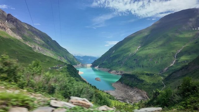 
Kaprun Alpine Reservoir And Dam Surrounded By Mountains

Kaprun reservoir and dam surrounded by green Alpine mountains, Austria, 11 August 2026.

