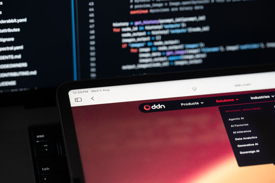 DDN Ai company web page on program code background