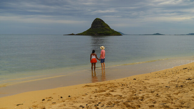 Interracial couple enjoying a beach in Hawaii