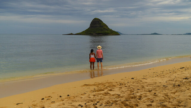 Interracial couple enjoying a beach in Hawaii