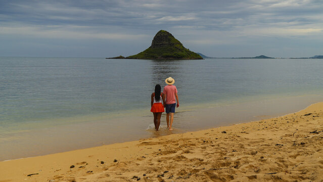 Interracial couple enjoying a beach in Hawaii