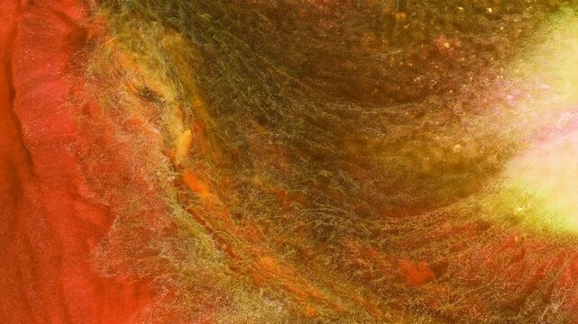 Mixing different colored alcohol inks in close-up view