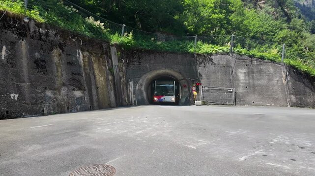 Bus Exiting Mountain Tunnel Near Kaprun Alpine Dam

Passenger bus exits mountain tunnel near Kaprun dam, Austria, 11 August 2026.


