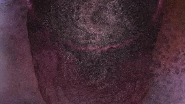 Mixing different colored alcohol inks in a close-up view of the process