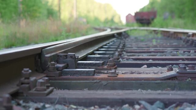 Mechanical railroad switch in operation track switch rail transport close up.