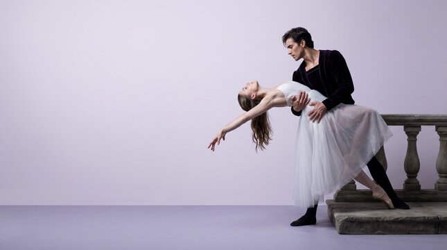 Ballet couple performing dramatic back bend extension inspired by Romeo and Juliet