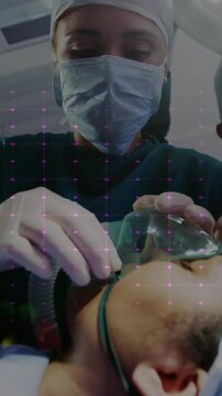 Medical professionals performing surgery over digital grid animation