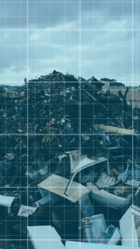Piles of electronic waste in landfill with data analysis animation over scene