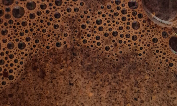 Fresh coffee crema texture with rich espresso foam bubbles, aromatic beverage surface background for cafe and coffee branding