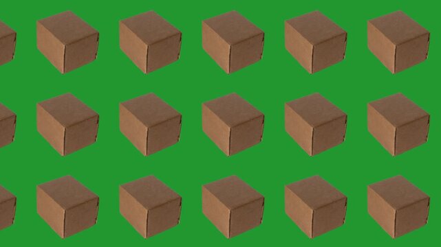 Shipping boxes are arranged in a pattern on a green background