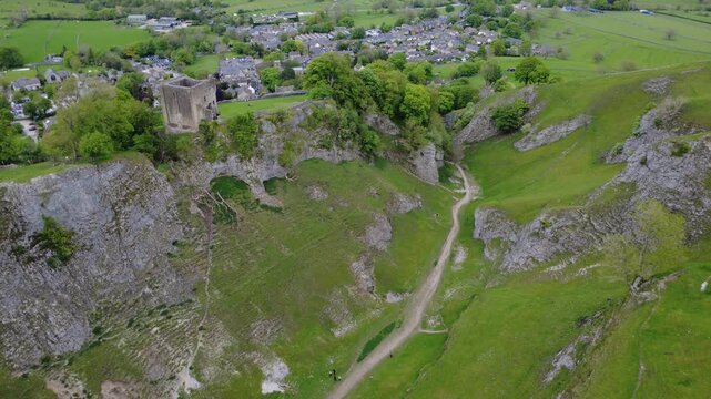 Aerial view of the dramatic Cave Dale limestone valley with a hiking path, Castleton, Peak District, England