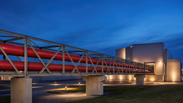 Elevated District Heating Pipeline Bridge at Blue Hour