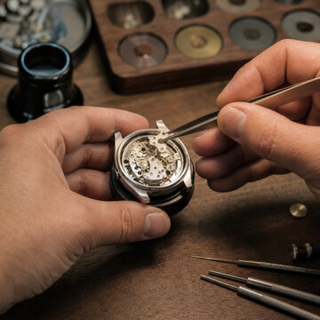 Watch Designer Assembling Mechanical Prototype at Horology Workbench