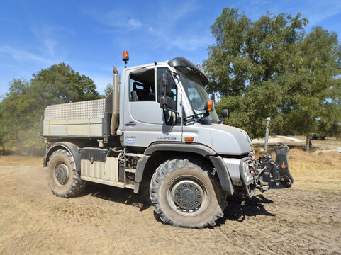 Mercedes-Benz Unimog high-mobility utility truck moving over rough ground